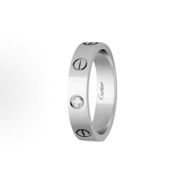 The Cartier Love ring series is set with one diamond and 18K white gold. It is a couple's LOVE wedding ring for both men and women