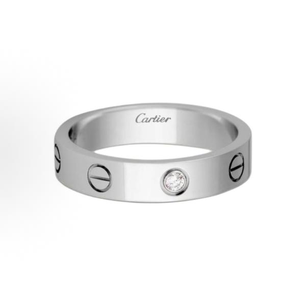 The Cartier Love ring series is set with one diamond and 18K white gold. It is a couple's LOVE wedding ring for both men and women