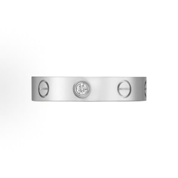 The Cartier Love ring series is set with one diamond and 18K white gold. It is a couple's LOVE wedding ring for both men and women